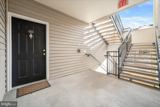 a view of a balcony with wooden floor