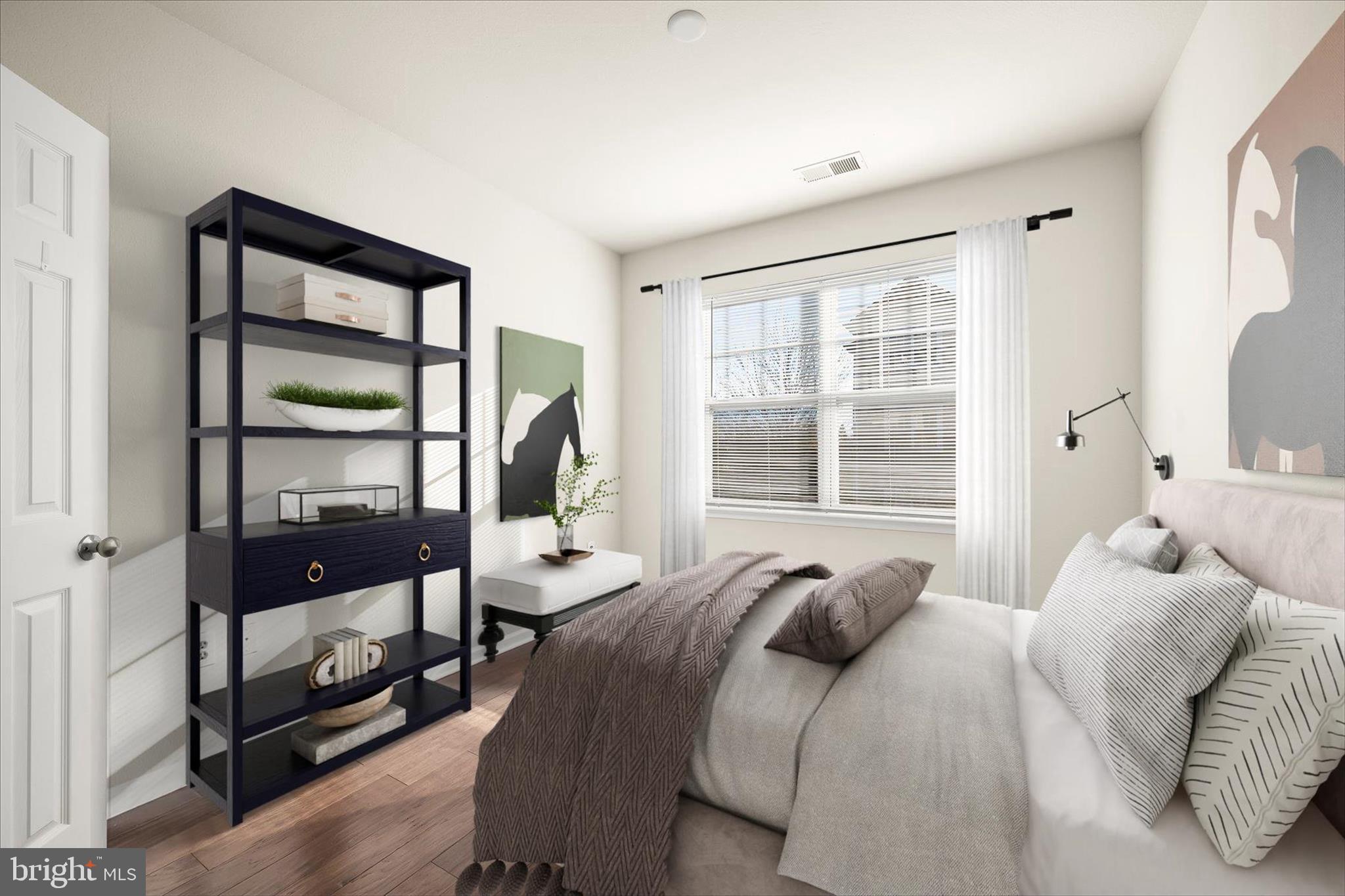 19620 Galway Bay Circle, Unit 302 Germantown, MD 20874 - Photo 5 of 36 a bedroom with a large bed and a window