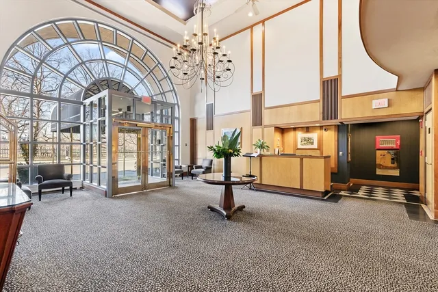 a view of hall way with furniture