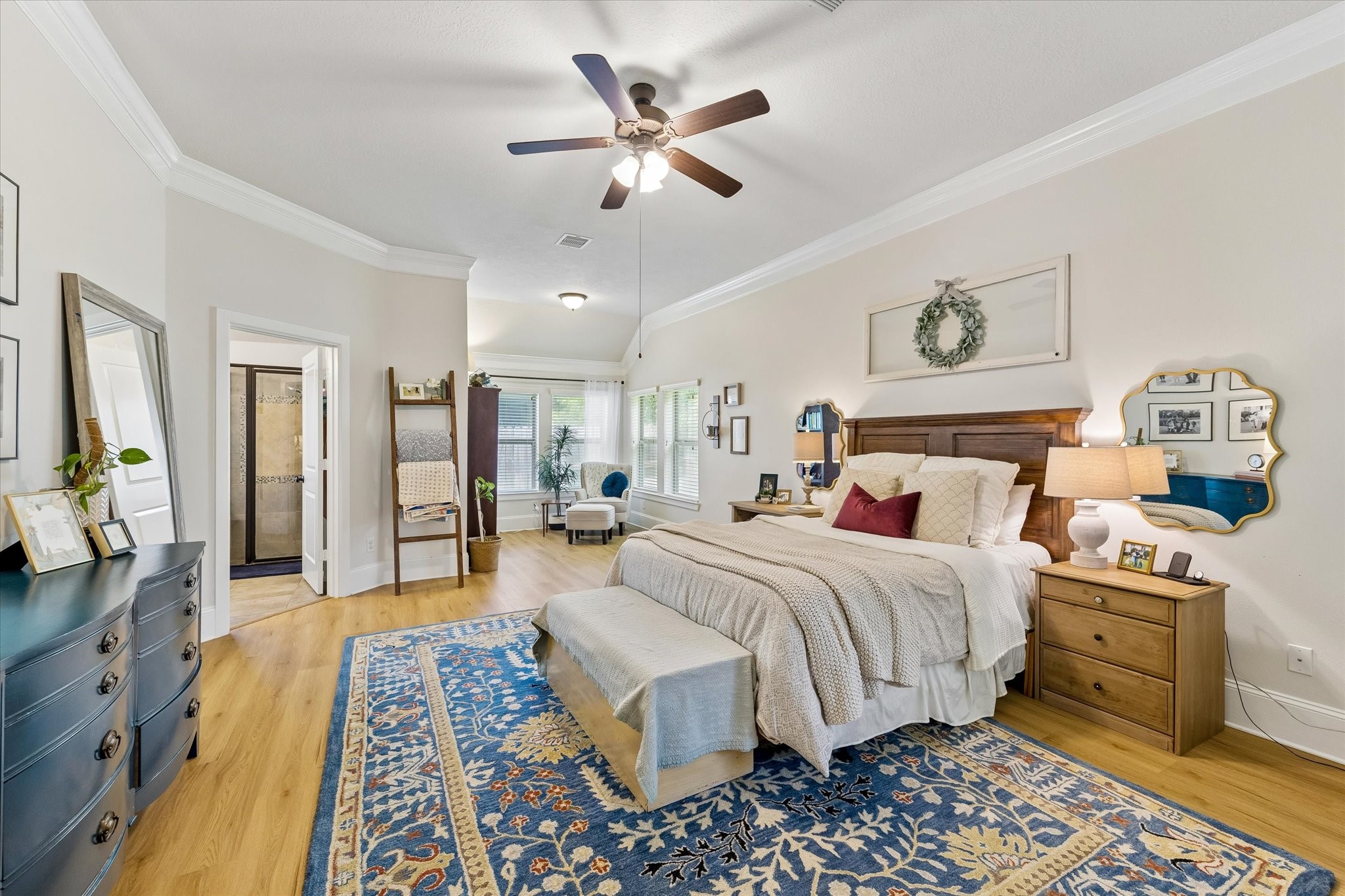31306 Brighton Brook Lane Spring, TX 77386 - Photo 16 of 34 Expansive primary suite featuring soaring ceilings, crown molding, abundant natural light, and a private sitting area perfect for reading or relaxing.