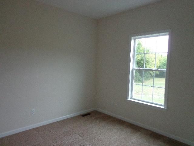 1455 Cliff Amos Road Spring Hill, TN 37174 - Photo 20 of 24 an empty room with a window