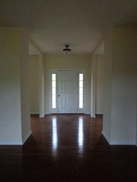 1455 Cliff Amos Road Spring Hill, TN 37174 - Photo 2 of 24 an empty room with wooden floor and windows