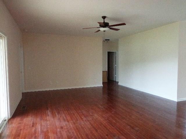 1455 Cliff Amos Road Spring Hill, TN 37174 - Photo 3 of 24 a view of wooden floor and a chandelier fan in a room