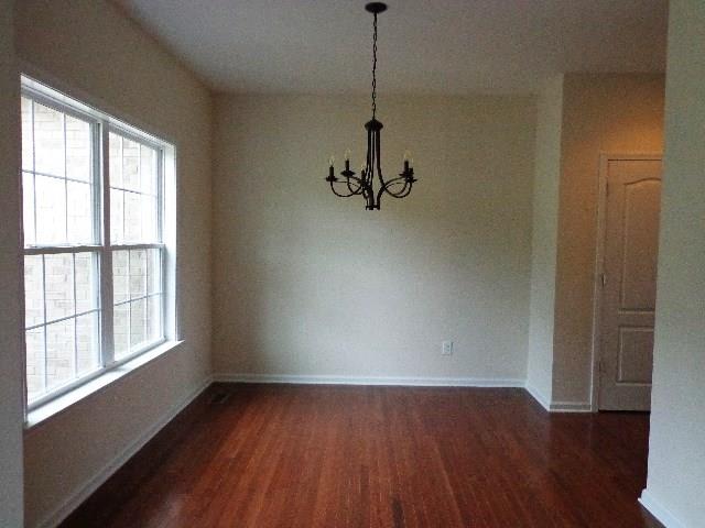 1455 Cliff Amos Road Spring Hill, TN 37174 - Photo 9 of 24 a view of a room with wooden floor and windows
