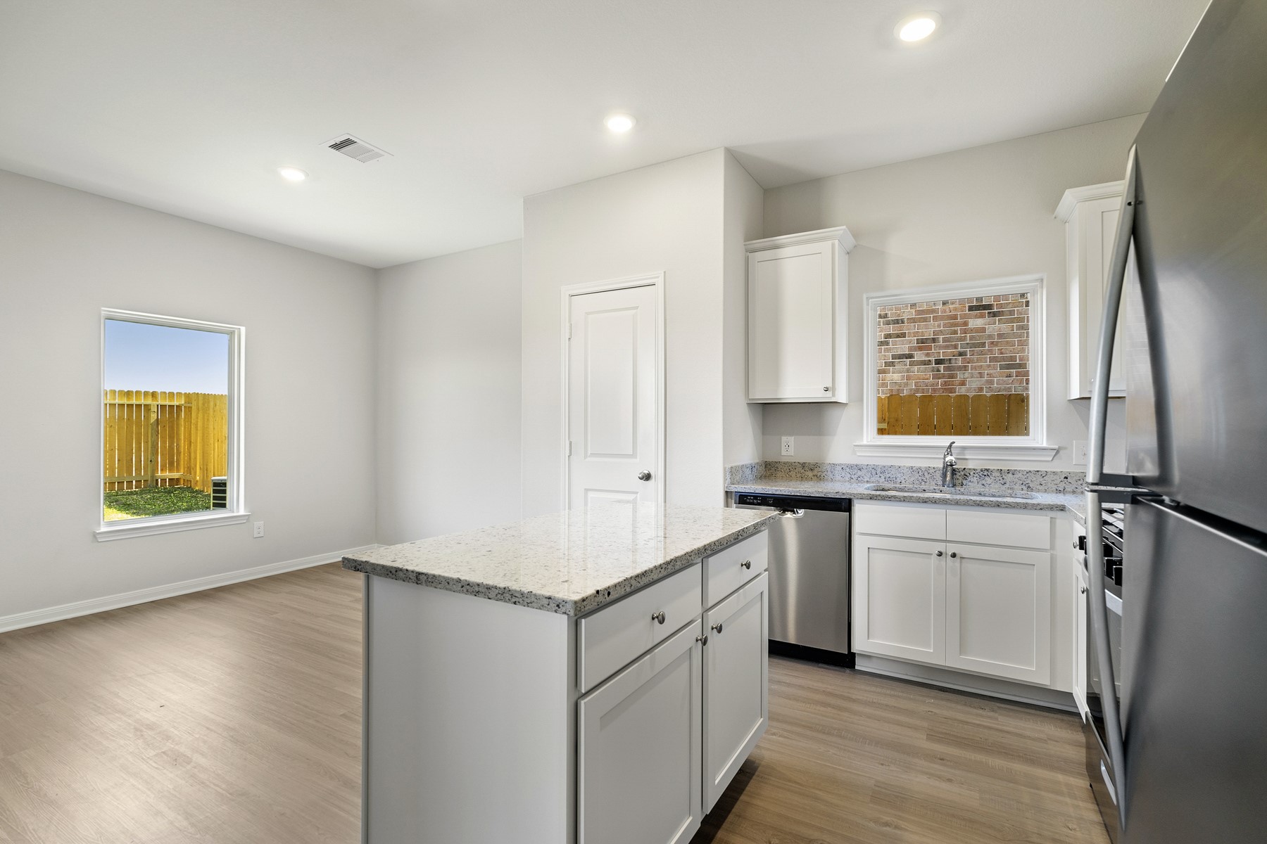 320 Tejas Trail Waller, TX 77484 - Photo 6 of 21 a kitchen with a refrigerator and a sink