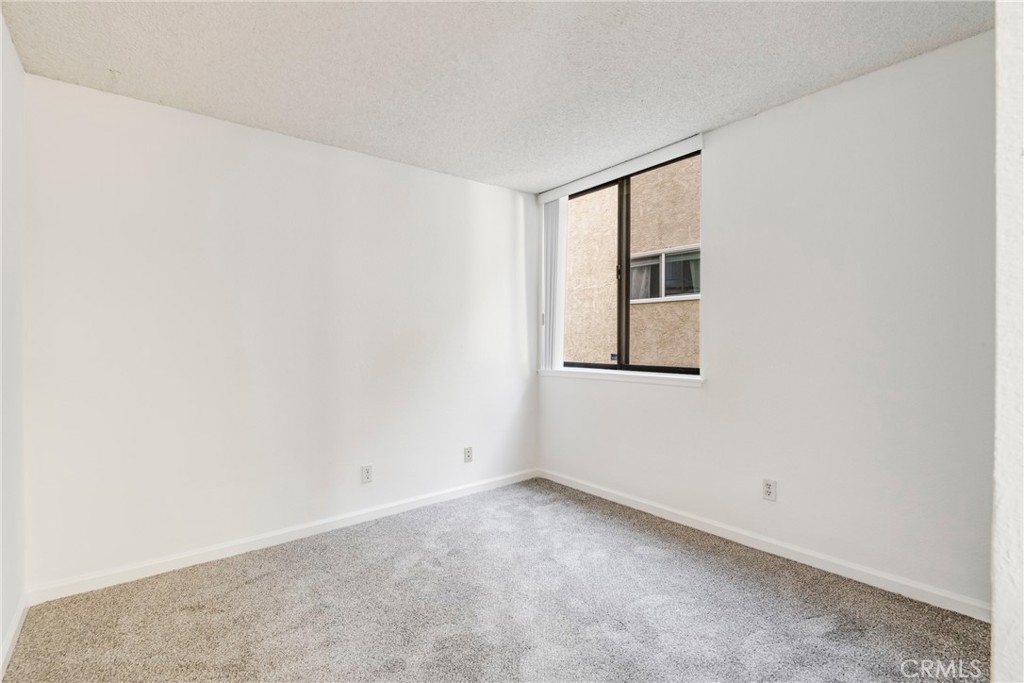 5987 Peacock Ridge Road, Unit 122 Rancho Palos Verdes, CA 90275 - Photo 15 of 31 a view of an empty room with a window
