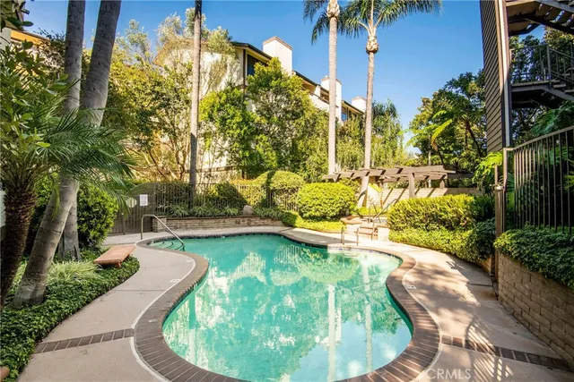 a swimming pool with outdoor seating and yard
