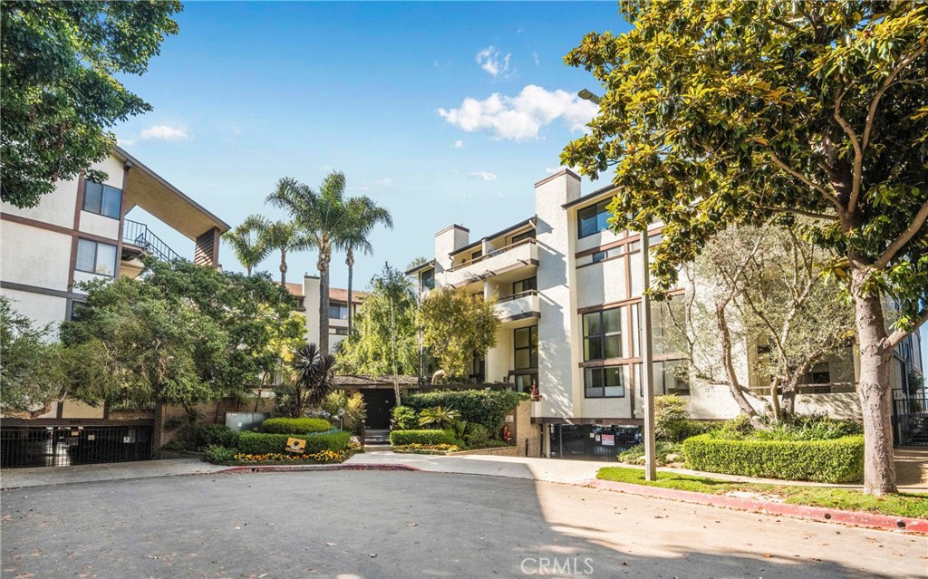 5987 Peacock Ridge Road, Unit 122 Rancho Palos Verdes, CA 90275 - Photo 2 of 31 a view of a brick building next to a road