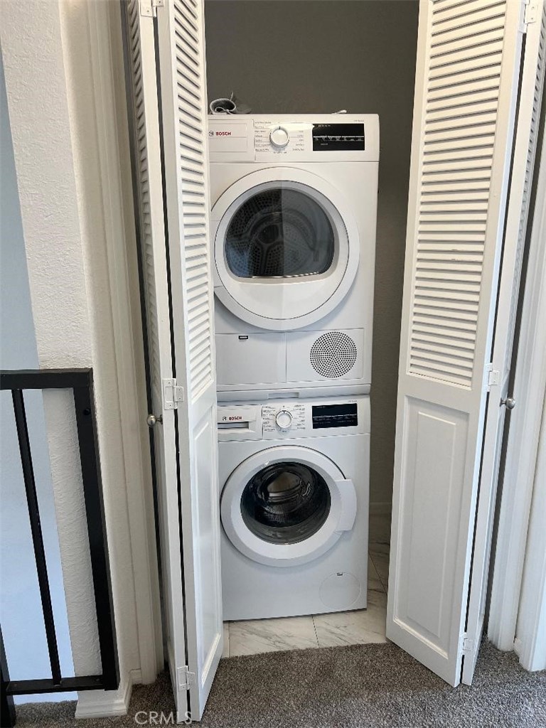 5987 Peacock Ridge Road, Unit 122 Rancho Palos Verdes, CA 90275 - Photo 21 of 31 a utility room with dryer and washer
