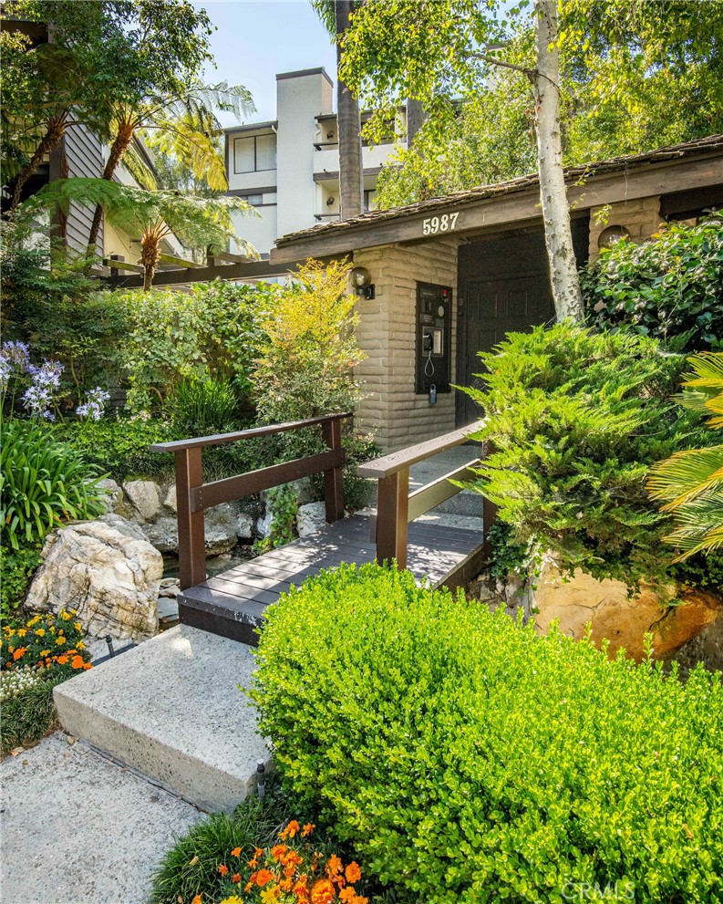 5987 Peacock Ridge Road, Unit 122 Rancho Palos Verdes, CA 90275 - Photo 3 of 31 front view of a house with a yard