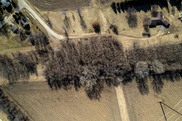 a view of a dry yard next to a building