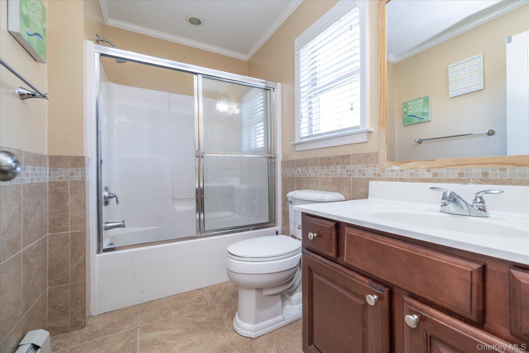 84-24 252nd Street Queens, NY 11426 - Photo 17 of 24 a bathroom with a sink a toilet and shower