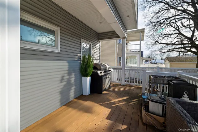 a view of a chairs and table in the balcony