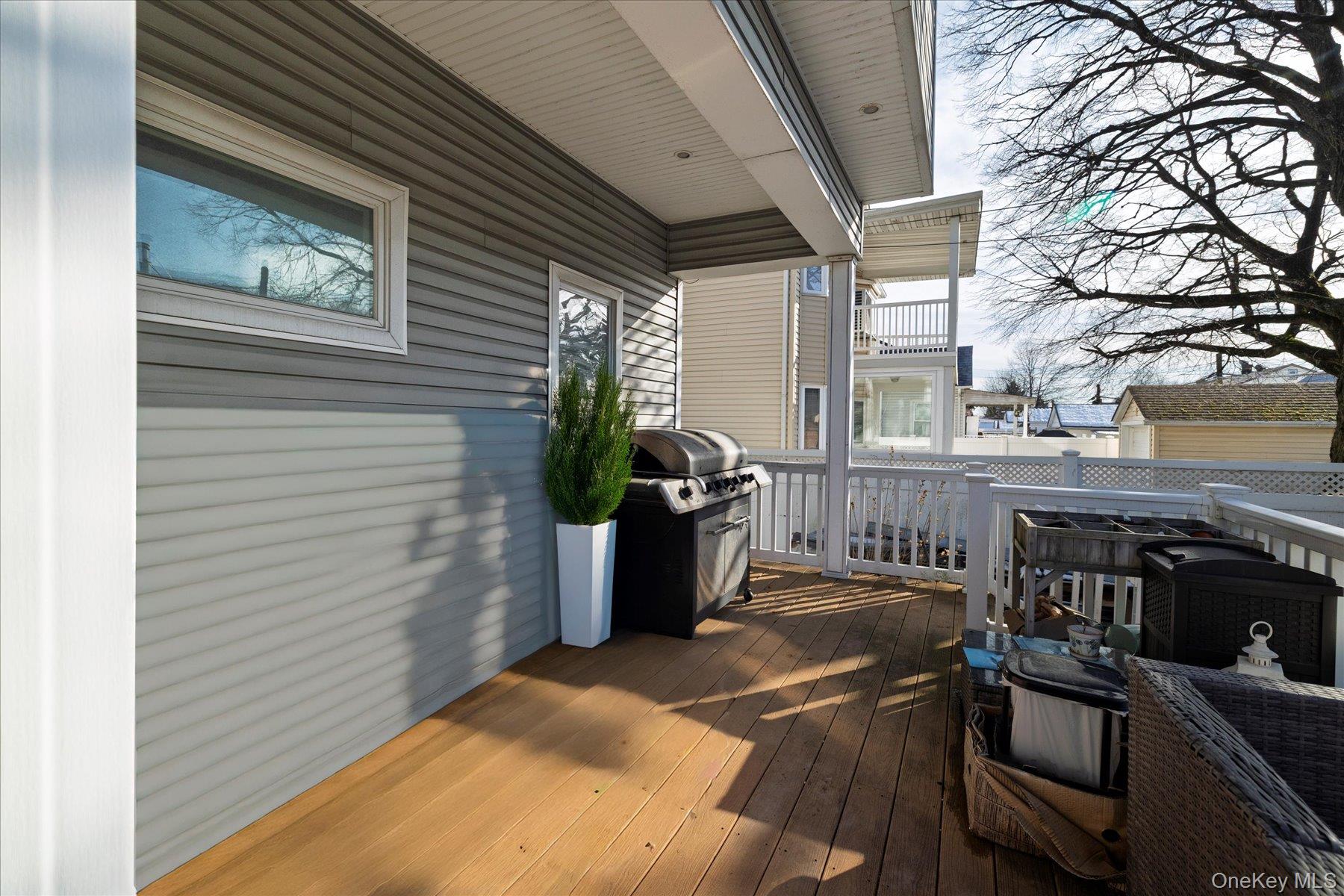 84-24 252nd Street Queens, NY 11426 - Photo 20 of 24 a view of a chairs and table in the balcony