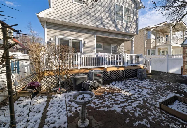 a view of a patio with chair and tables