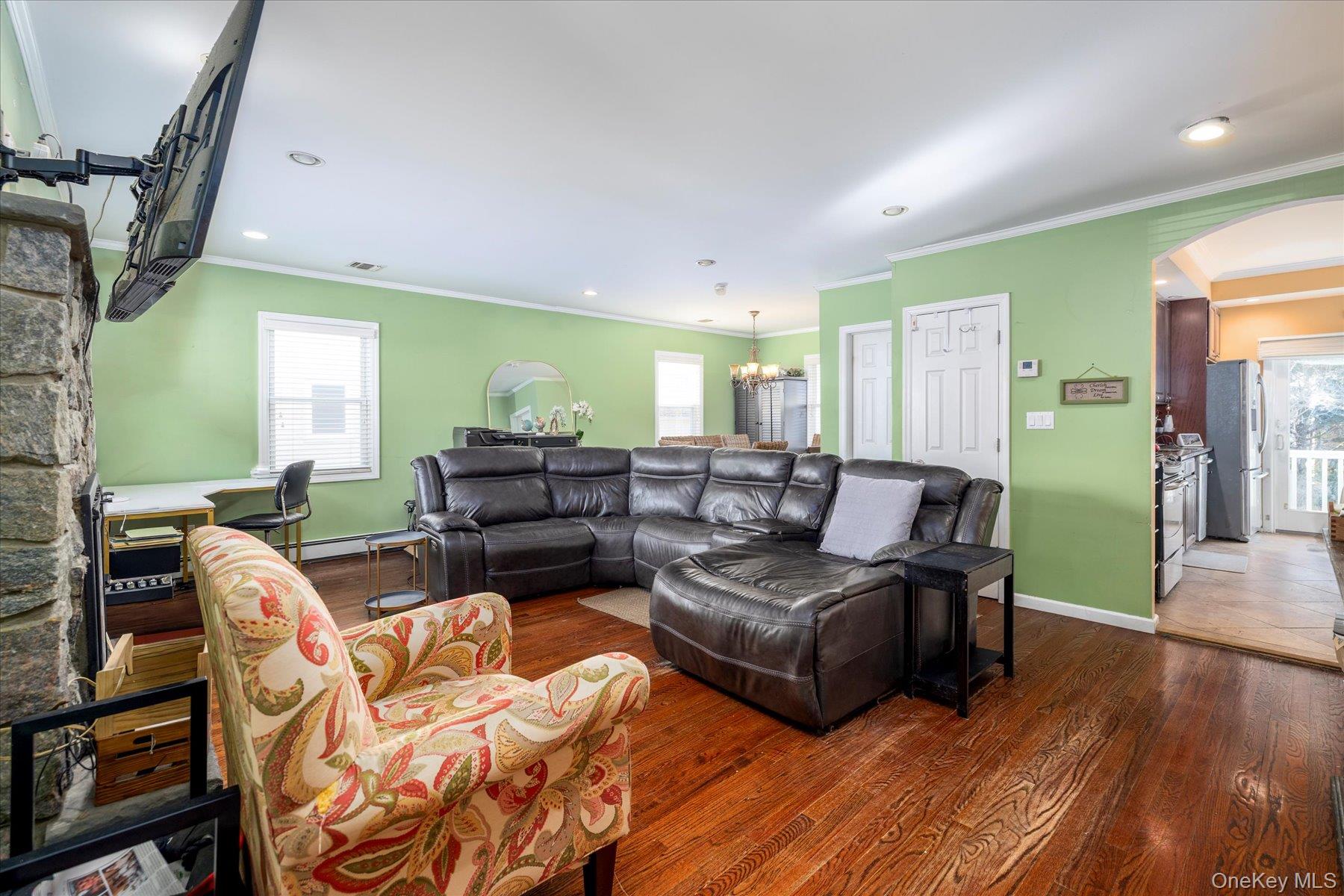 84-24 252nd Street Queens, NY 11426 - Photo 5 of 24 a living room with furniture and a wooden floor