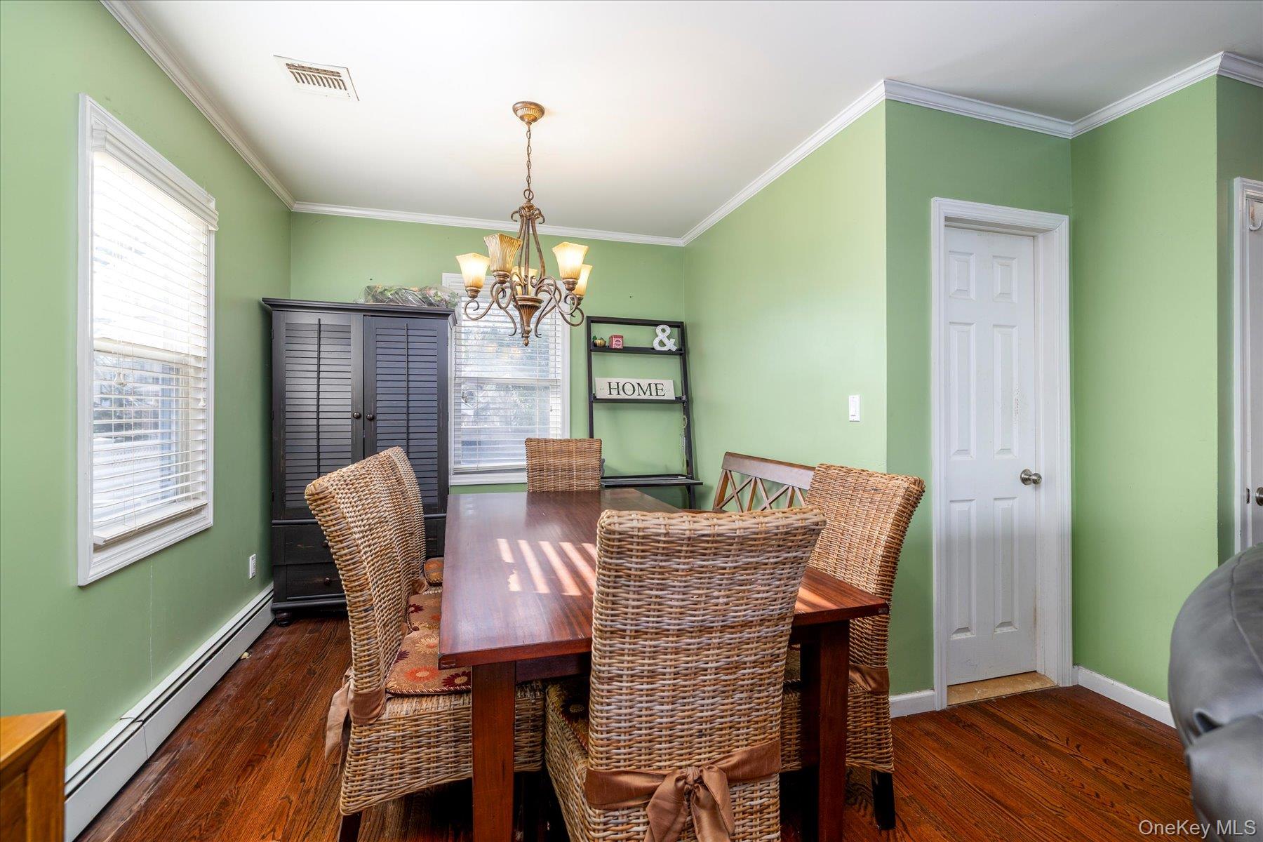 84-24 252nd Street Queens, NY 11426 - Photo 7 of 24 a view of a dining room with furniture window and wooden floor