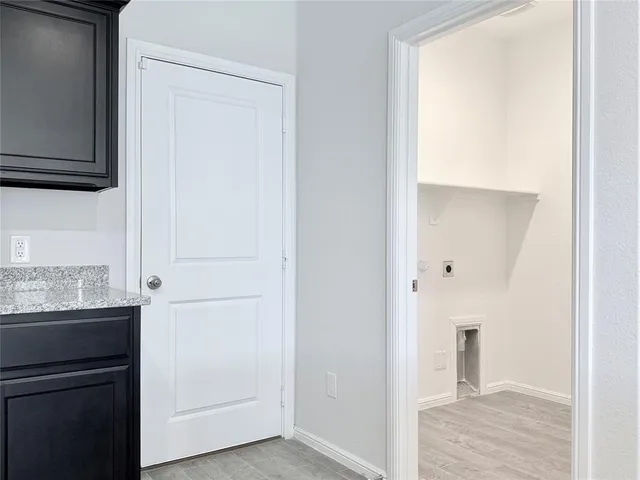 a view of a kitchen from the hallway