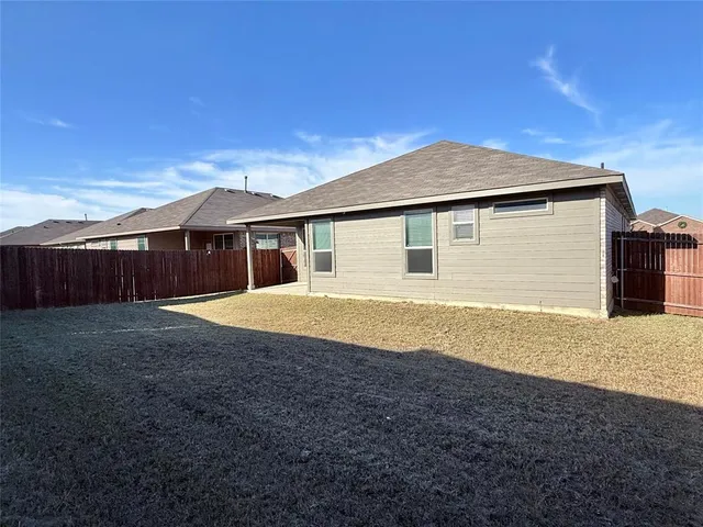 a house view with a backyard space