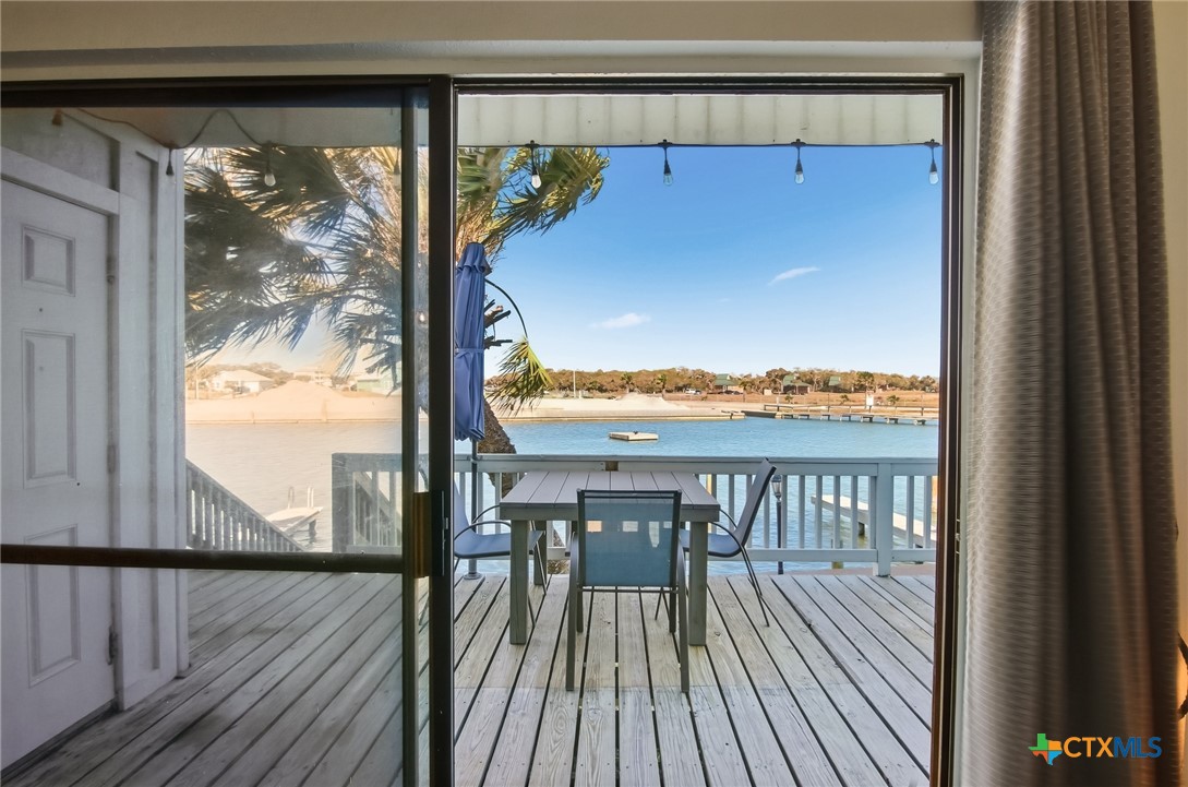 2292 North Fulton Beach Road, Unit 505 Rockport, TX 78382 - Photo 4 of 46 a view of a balcony with wooden floor