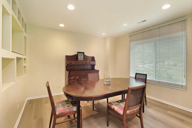 a living room with furniture a rug and a window