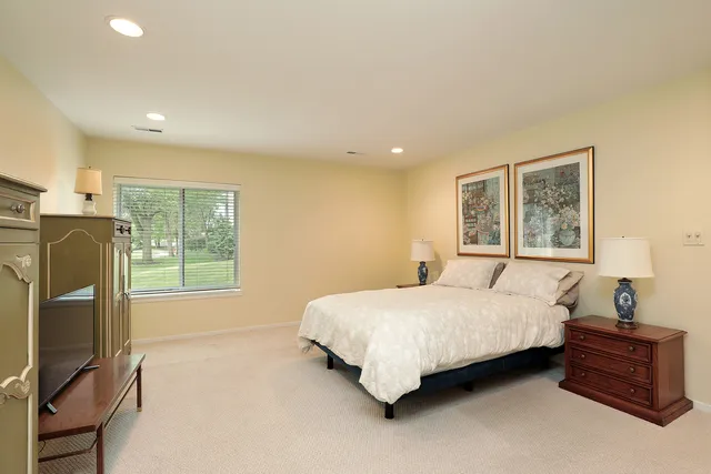a bathroom with a sink vanity and a toilet