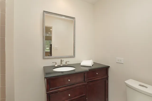 a bedroom with bed and furniture