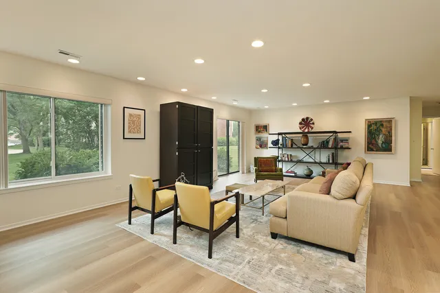 a view of a dining room with furniture and window