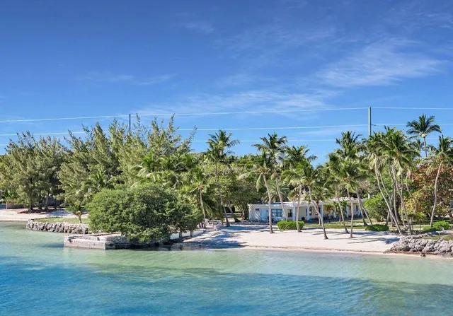 a view of a swimming pool with an outdoor space and seating area