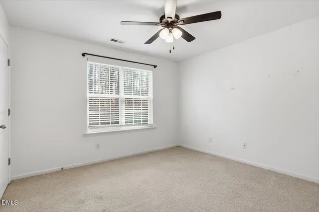 a view of a house that has a window and door