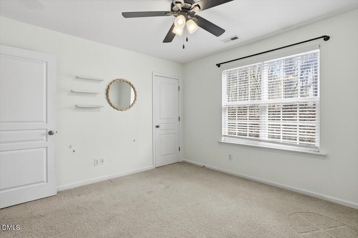 4307 Sugarbend Way Raleigh, NC 27606 - Photo 26 of 35 a view of an empty room with a window