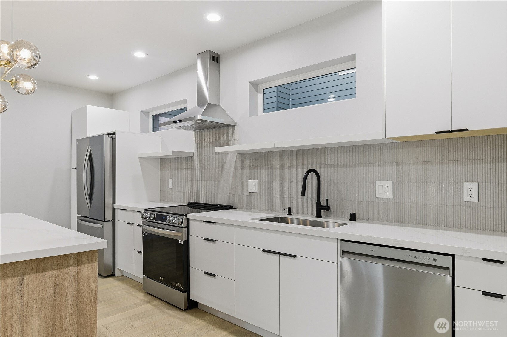 11831 59th Avenue South, Unit B Seattle, WA 98178 - Photo 2 of 19 a kitchen with stainless steel appliances granite countertop a sink stove and refrigerator