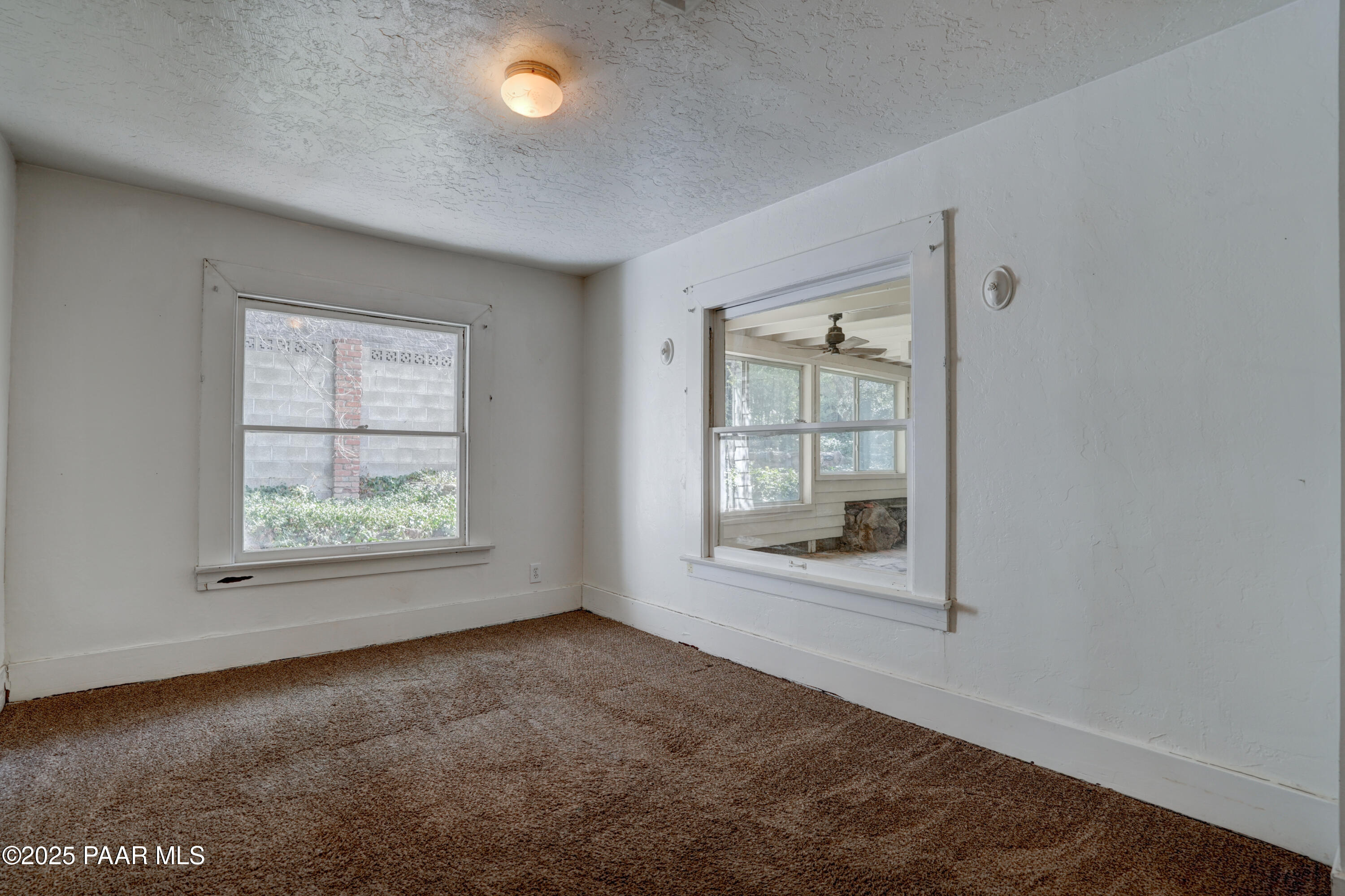 719 Pima Road Prescott, AZ 86303 - Photo 16 of 31 an empty room with windows and closet