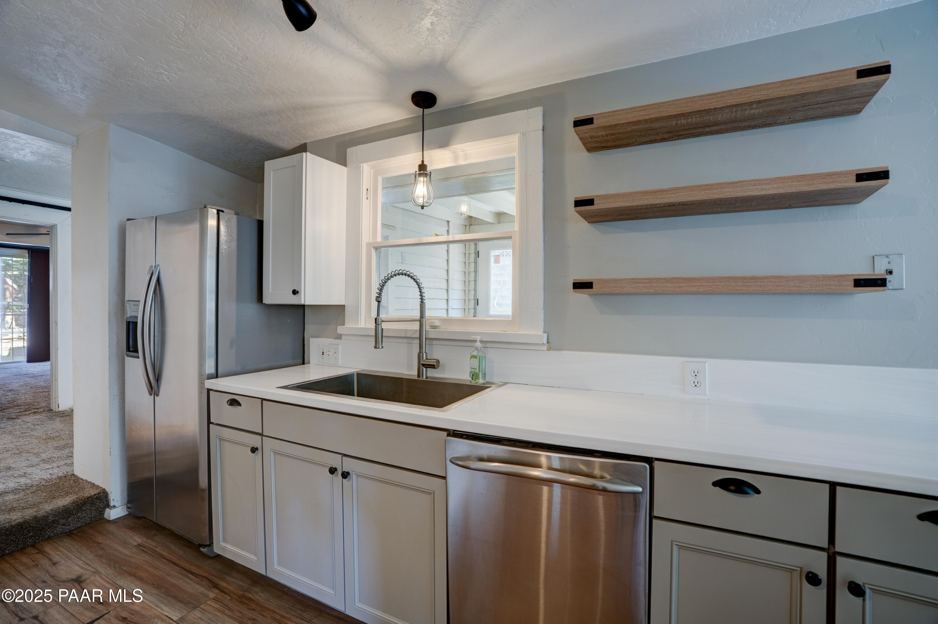 719 Pima Road Prescott, AZ 86303 - Photo 19 of 31 a kitchen with a sink and cabinets