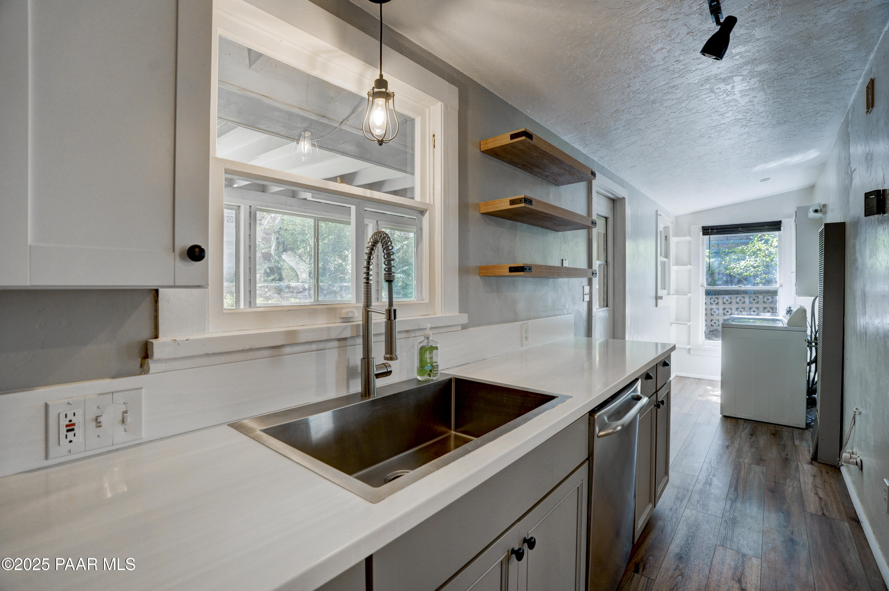 719 Pima Road Prescott, AZ 86303 - Photo 20 of 31 a kitchen that has a sink and a stove top oven