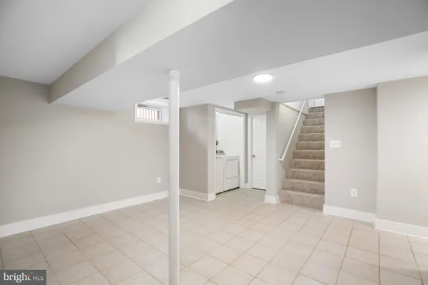 an entryway of a room with stairs and ventilation