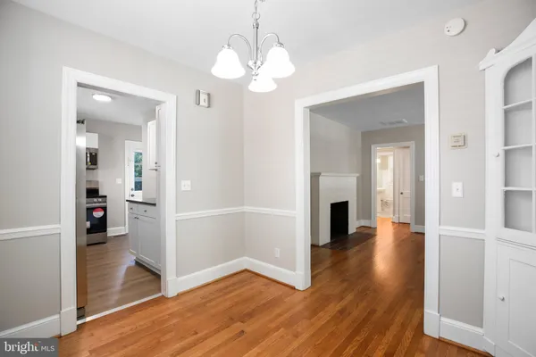 wooden floor in an empty room and a fireplace