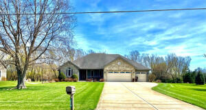 655 South 150 East Kouts, IN 46347 - Photo 1 of 1 a front view of house with yard and green space