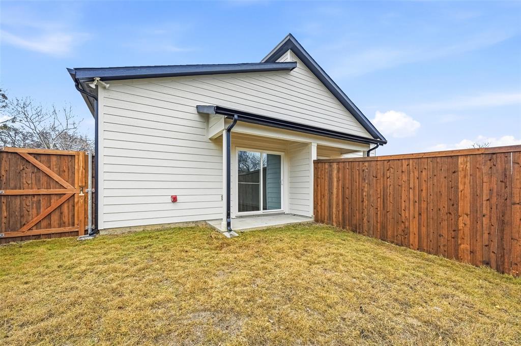 1311 Oneal Street, Unit B Commerce, TX 75428 - Photo 15 of 17 a view of a house with a yard