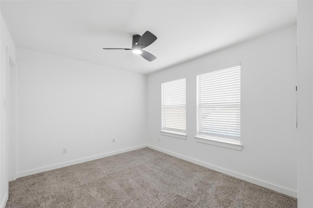 1311 Oneal Street, Unit B Commerce, TX 75428 - Photo 7 of 17 an empty room with windows