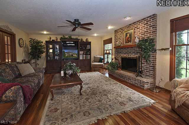 357 Longspur Road Highland Heights, OH 44143 - Photo 5 of 22 Huge family room flows from the kitchen and breakfast room, features a floor to ceiling brick gas/wood burning fireplace with large raised hearth and French doors opening to the living room