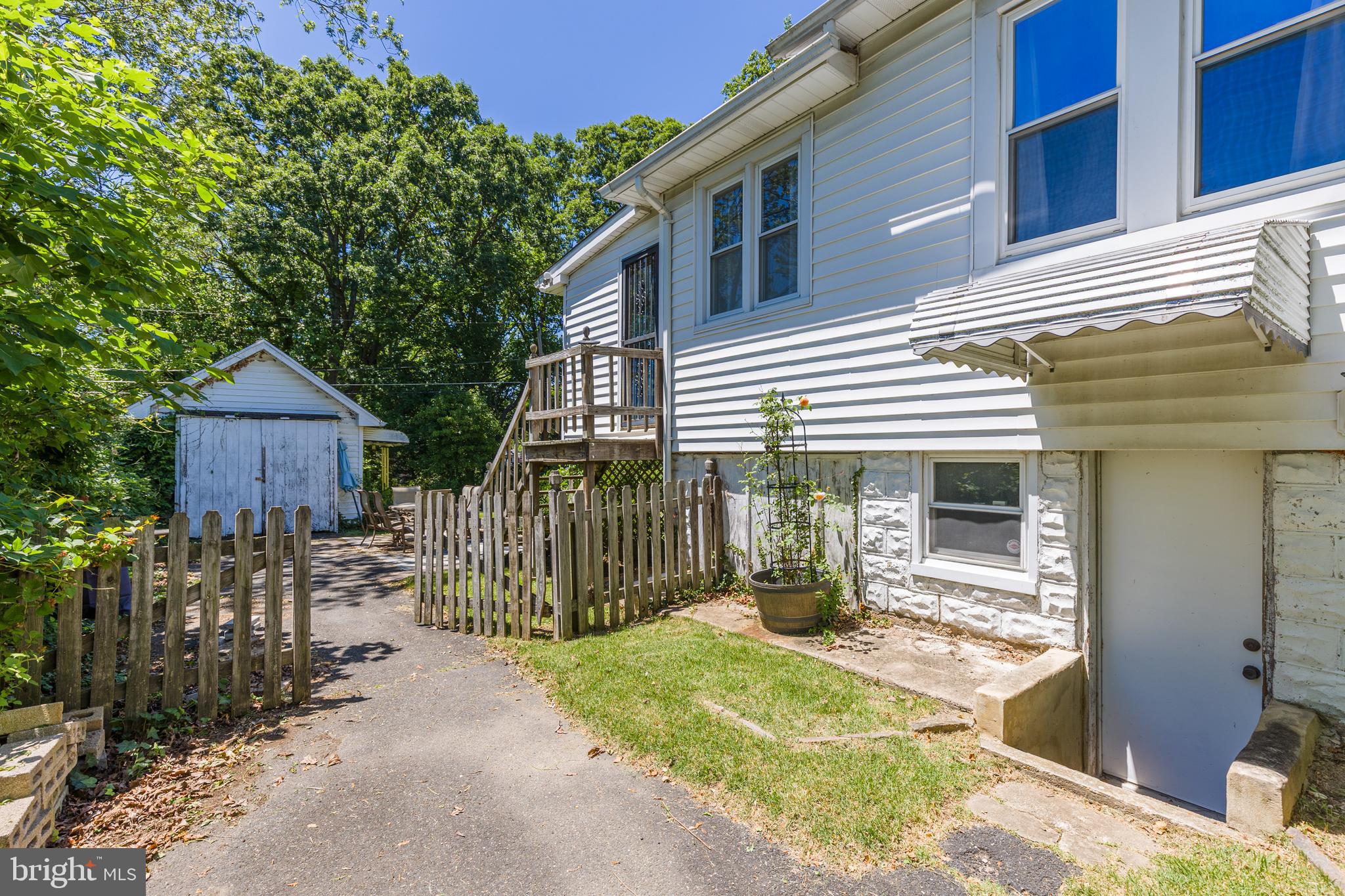 6426 Sherwood Road Baltimore, MD 21239 - Photo 37 of 43 a front view of a house with a outdoor space