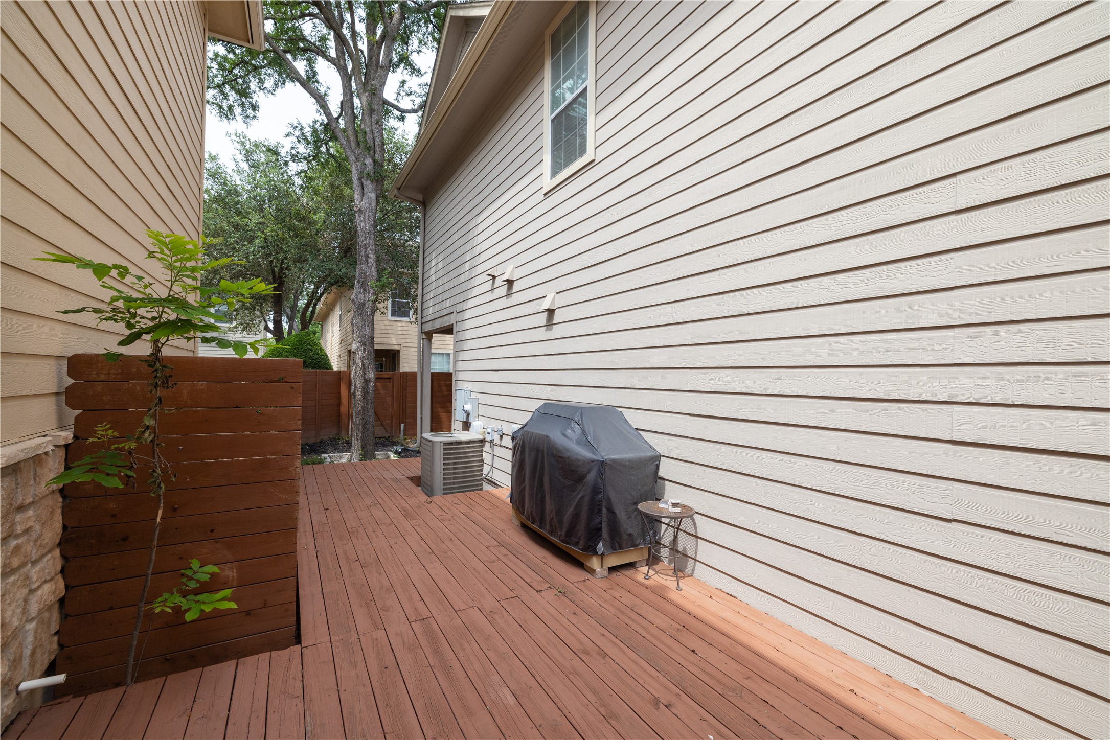 11000 Anderson Mill Road, Unit 45 Austin, TX 78750 - Photo 19 of 32 a view of backyard with chair and wooden floor