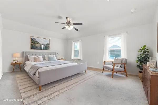 a spacious bedroom with a large bed and a couch