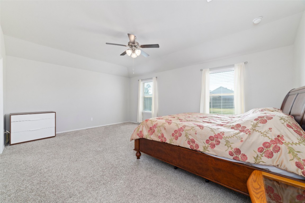 24323 Winchelsea Lane Spring, TX 77389 - Photo 19 of 27 a bed sitting in a bedroom next to a window