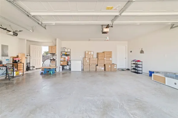 a view of a livingroom with furniture and a garage