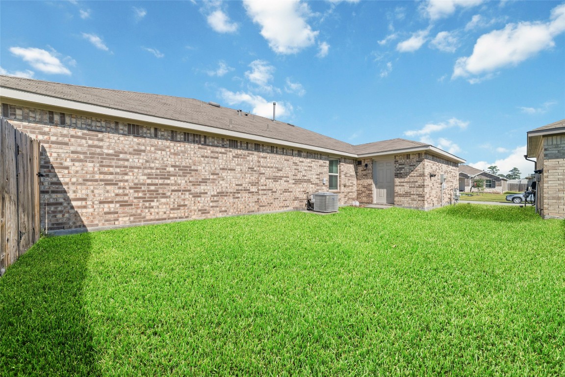 24323 Winchelsea Lane Spring, TX 77389 - Photo 26 of 27 a view of a house with a big yard and large tree