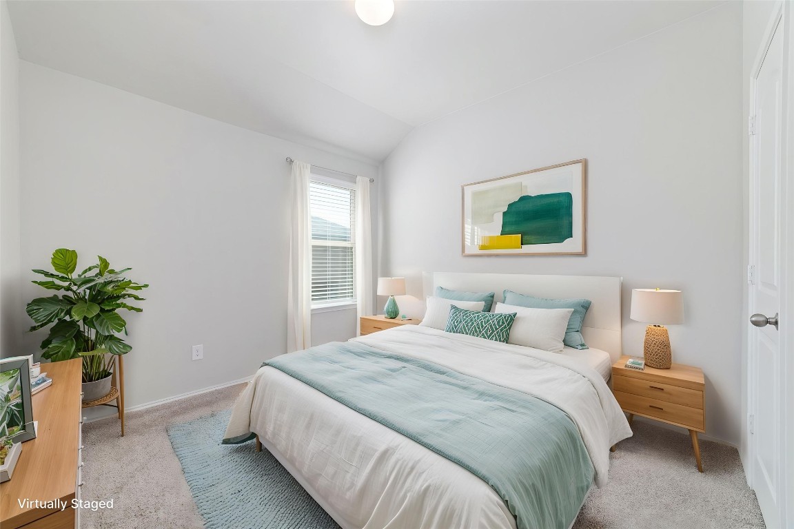 24323 Winchelsea Lane Spring, TX 77389 - Photo 9 of 27 a bedroom with a bed and a potted plant