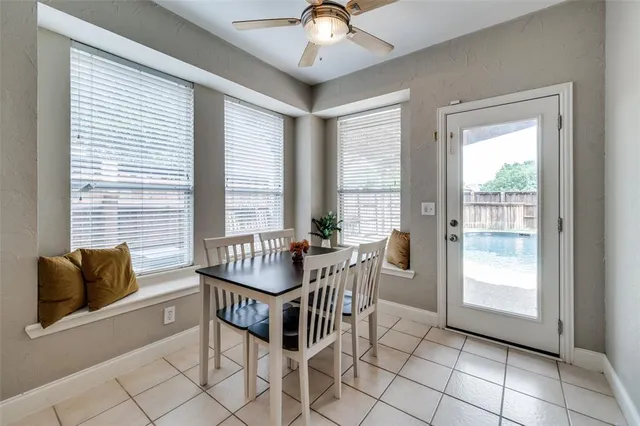 a dining room with furniture and window