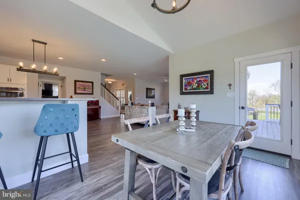 a kitchen with white cabinets and a sink